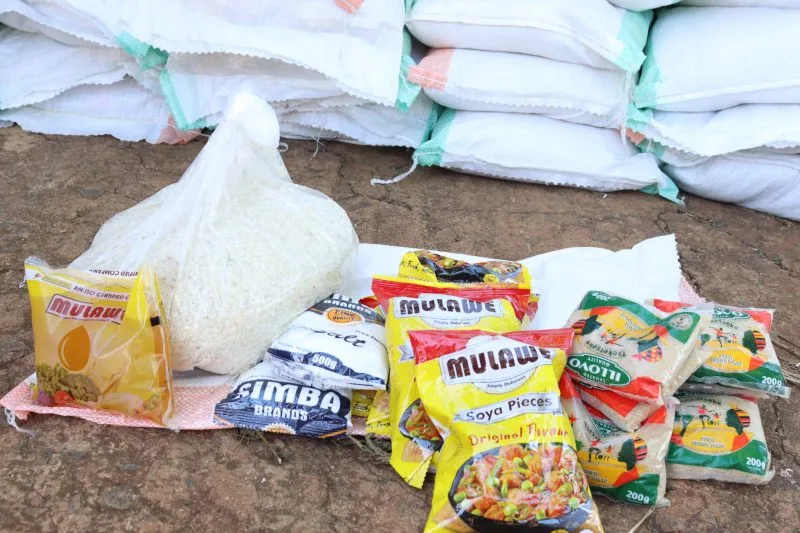 Community members receiving food packs